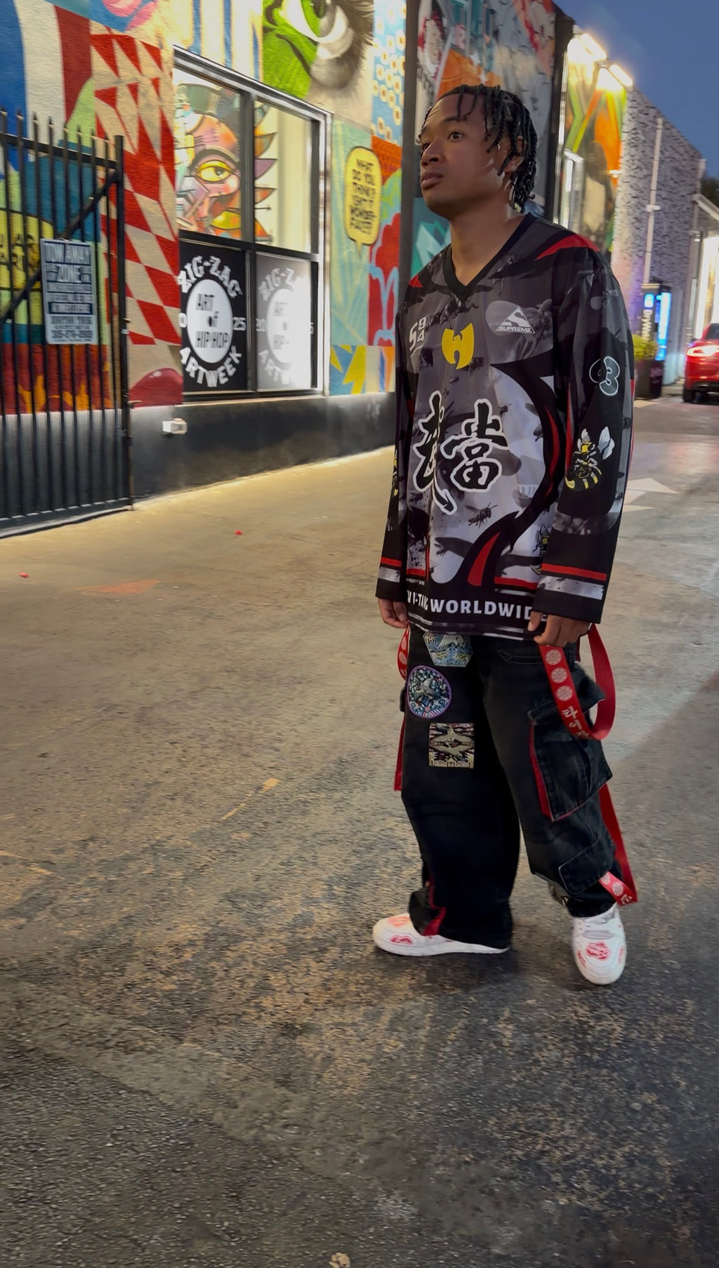 Model wearing TY’JAMIN Joseon Noir jeans on a city street