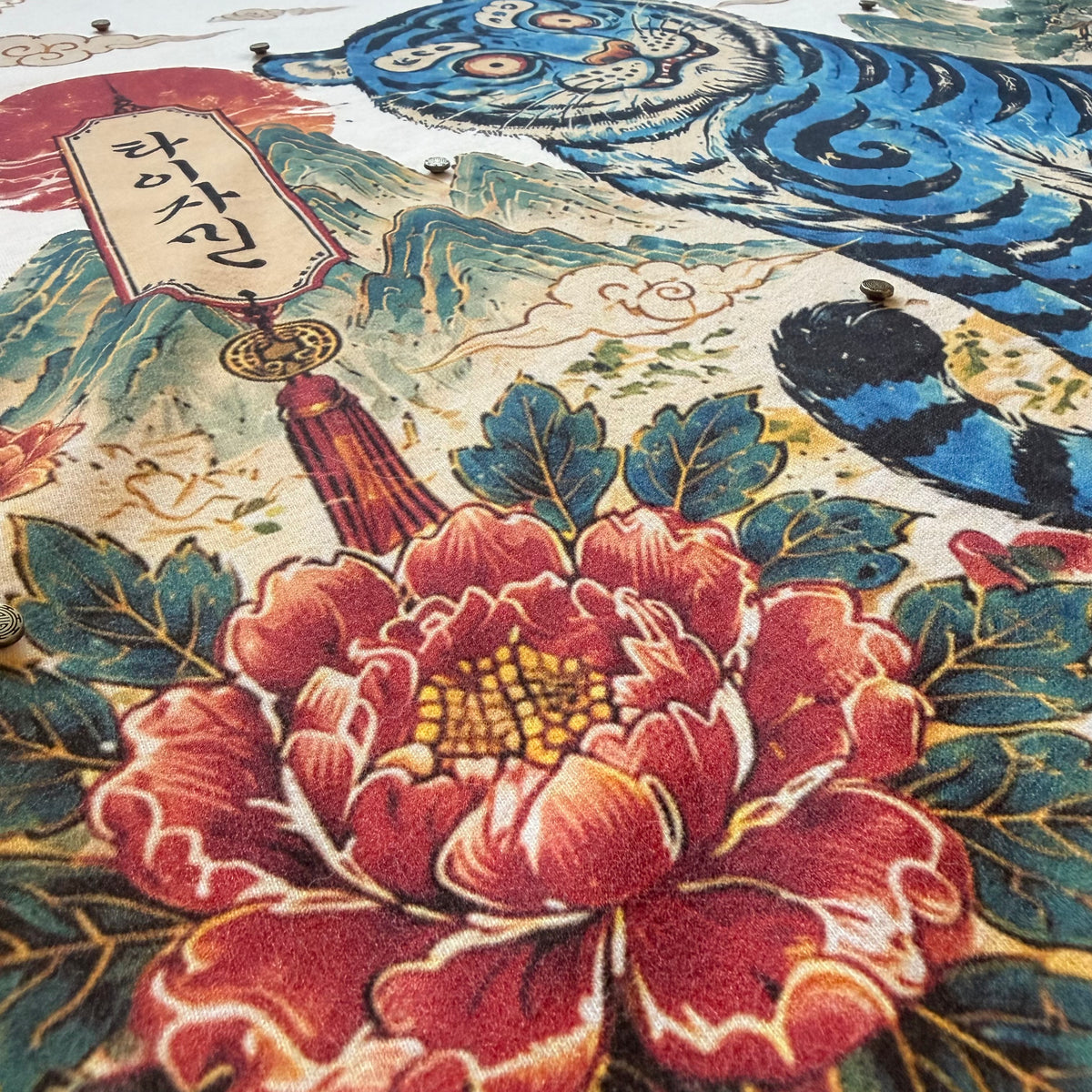 Babo Horangi artwork with blue tiger, red flowers, landscape details and metal accents